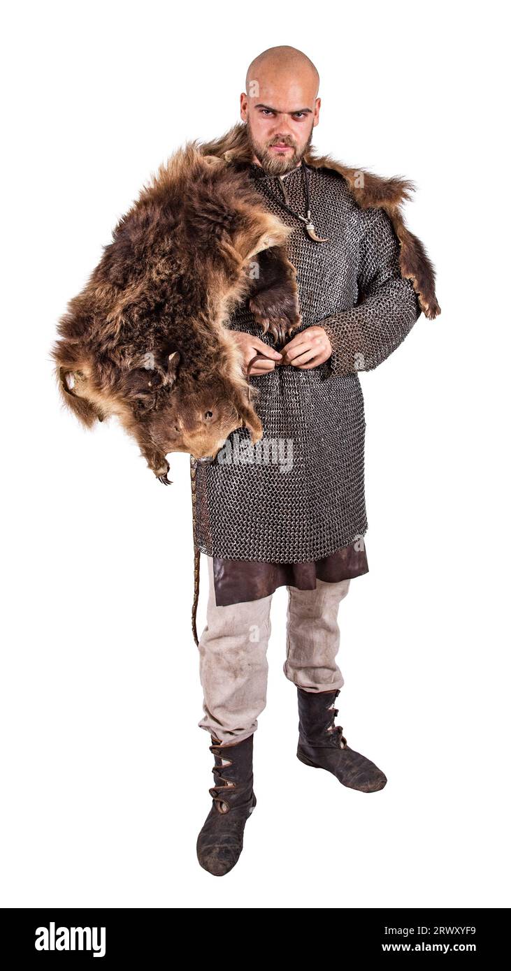 Medieval viking in chain mail and a bearskin rug. Isolated on white ...