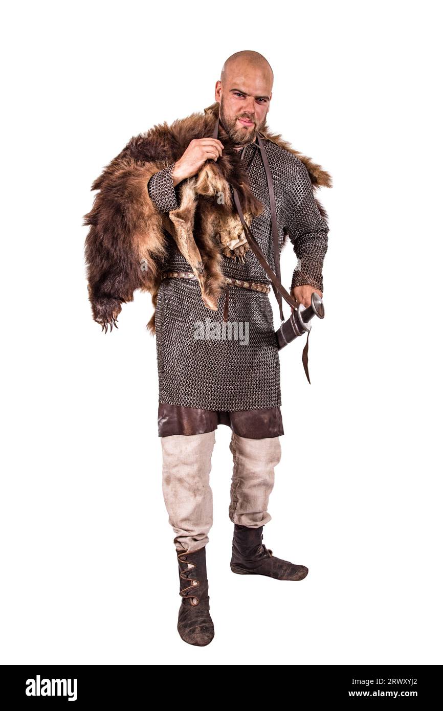 Medieval viking in chain mail and a bearskin rug. Isolated on white Stock Photo