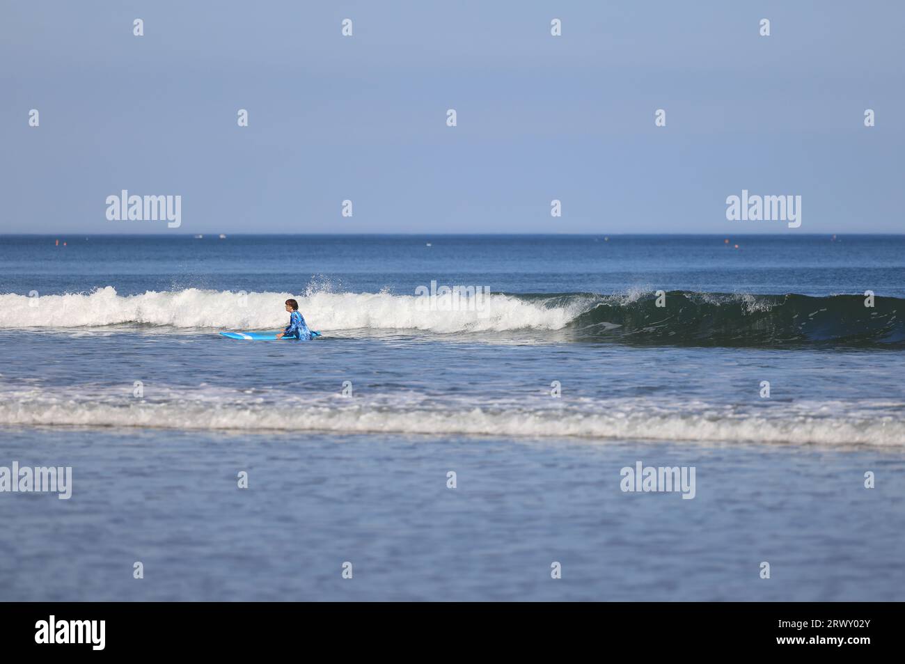 Body surfing on the sea at West Cliff beach in Whitby, North Yorkshire