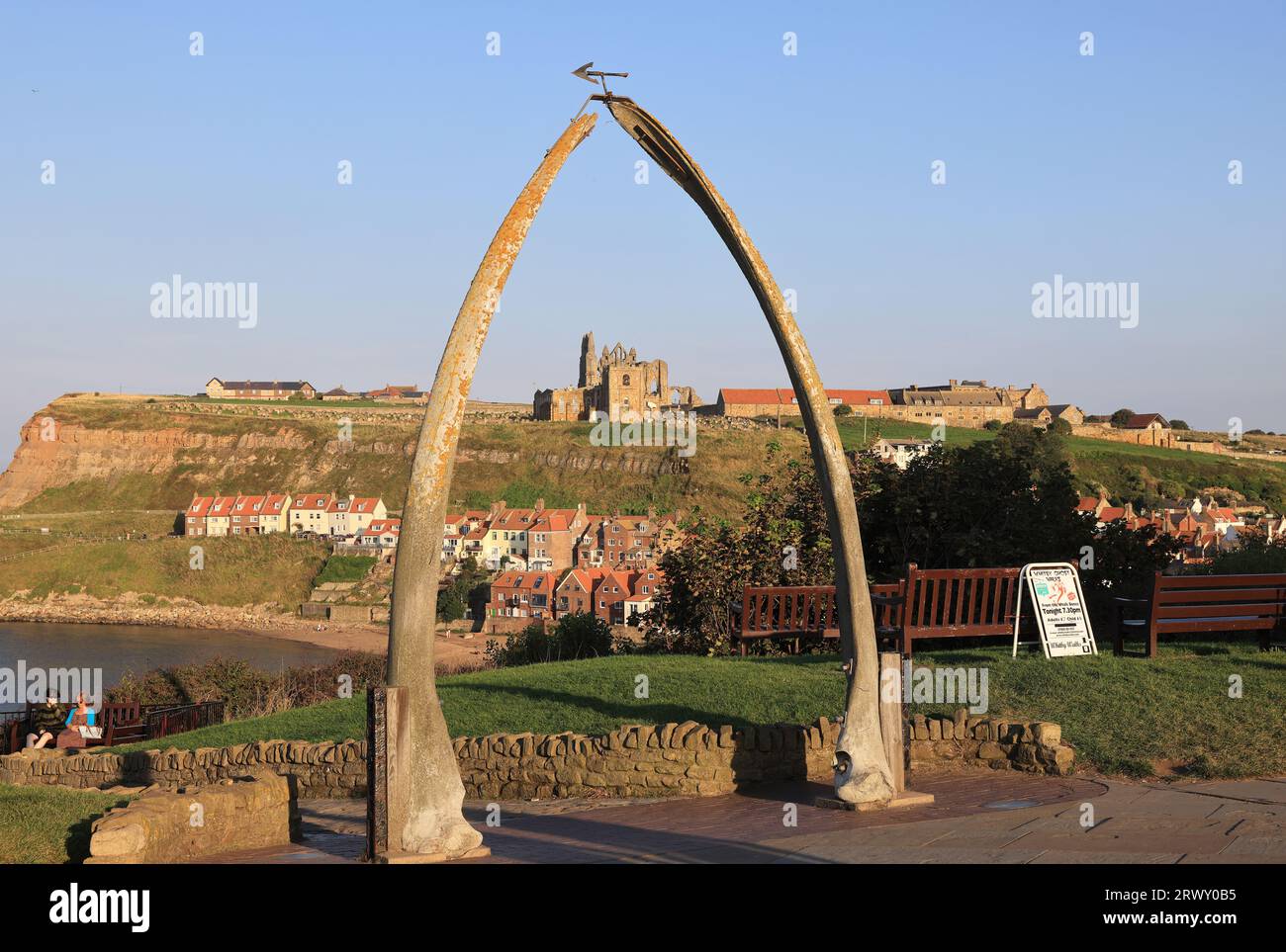 In Whitby to recognise the town's important whaling history, a whale bone arch stands on the West Cliff, a perfect photo opportunity, North Yorkshire, Stock Photo