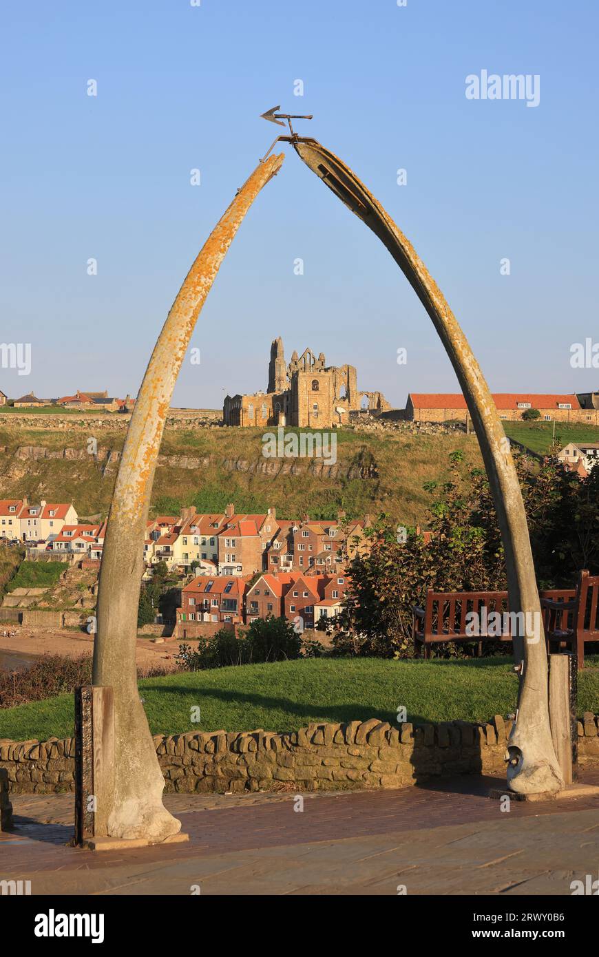 In Whitby to recognise the town's important whaling history, a whale bone arch stands on the West Cliff, a perfect photo opportunity, North Yorkshire, Stock Photo