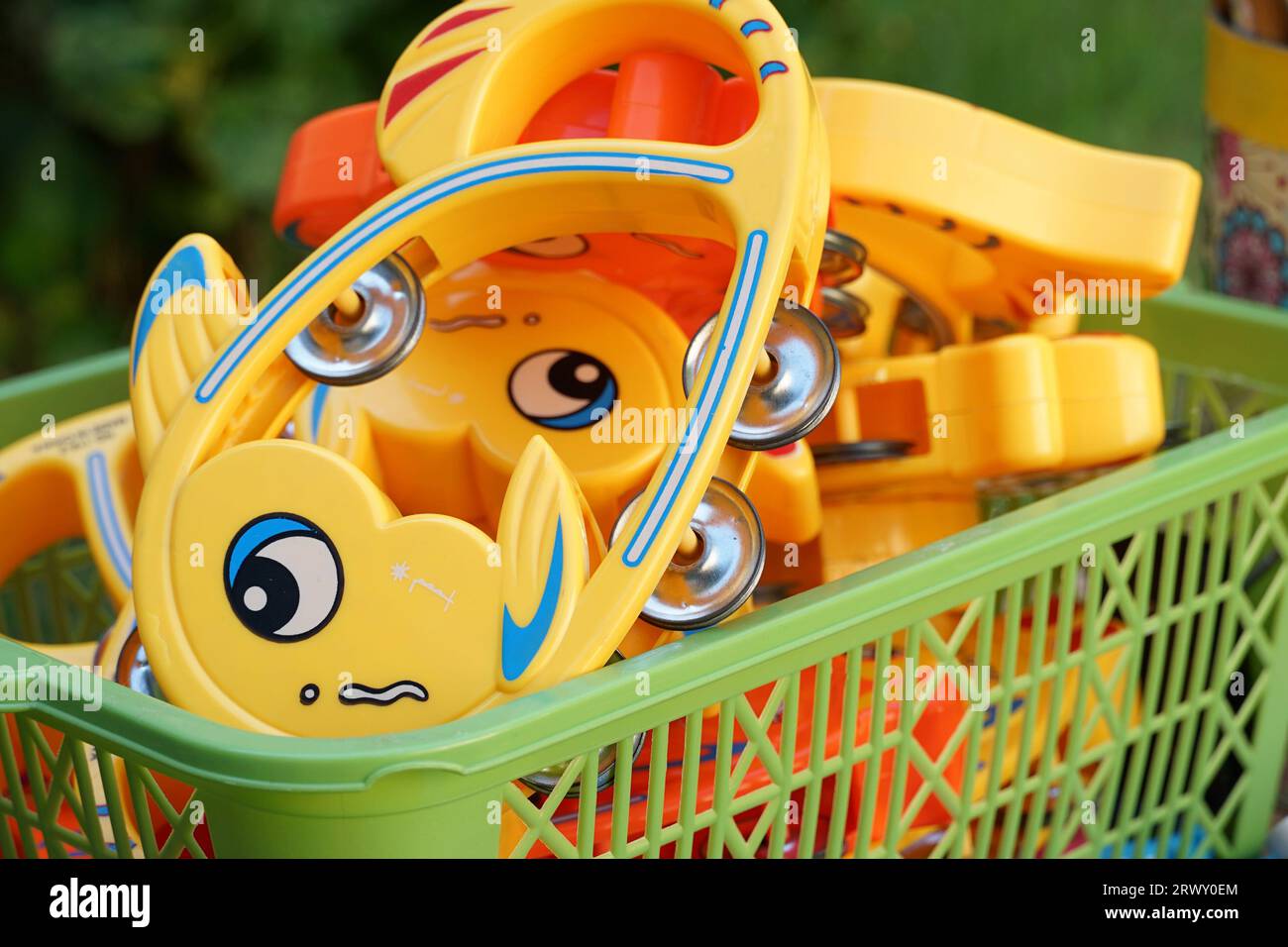 Children's musical instruments in a basket Stock Photo Alamy