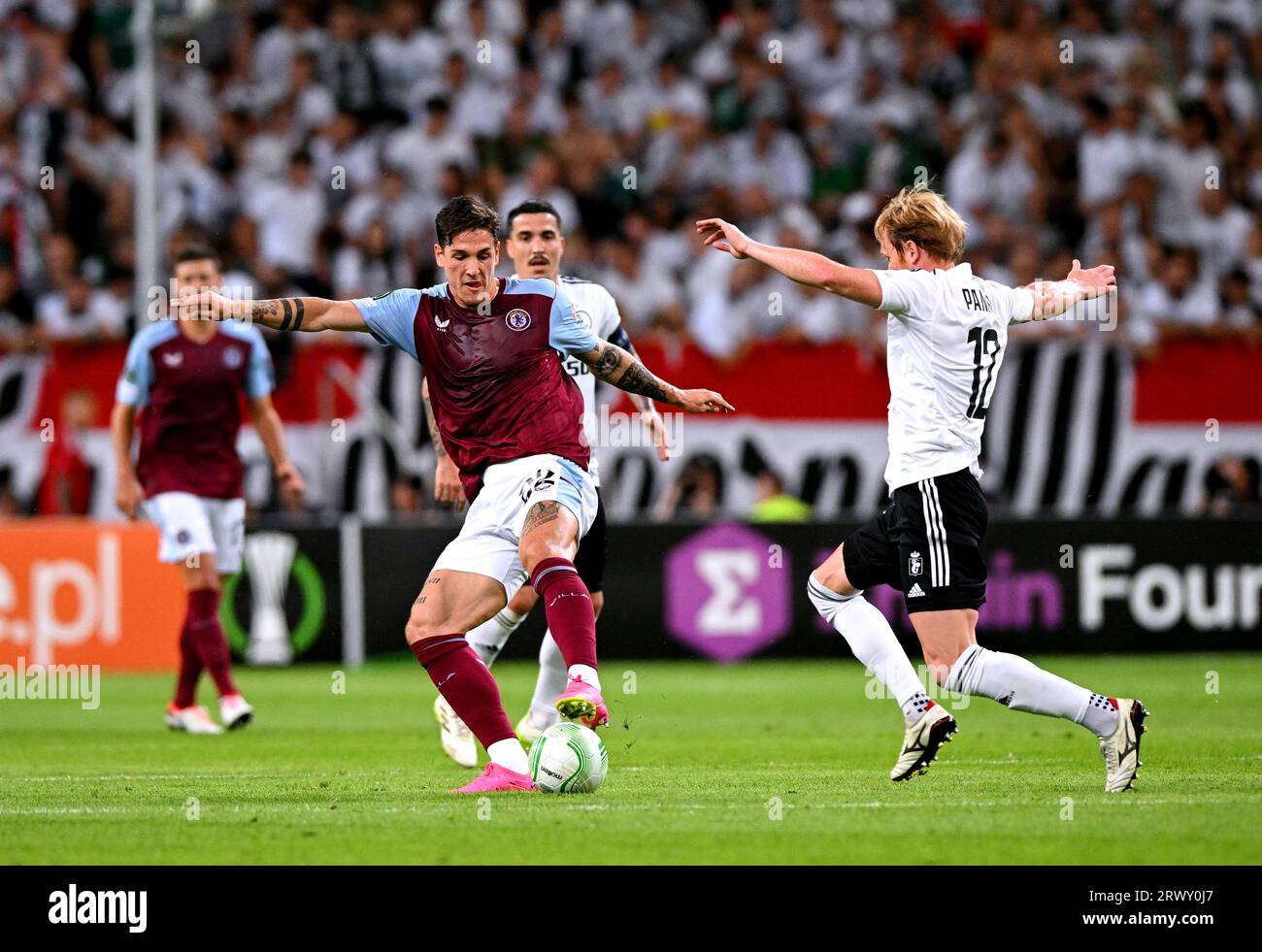 Aston Villa's Nicolo Zaniolo (left) and Legia Warsaw's Radovan Pankov ...