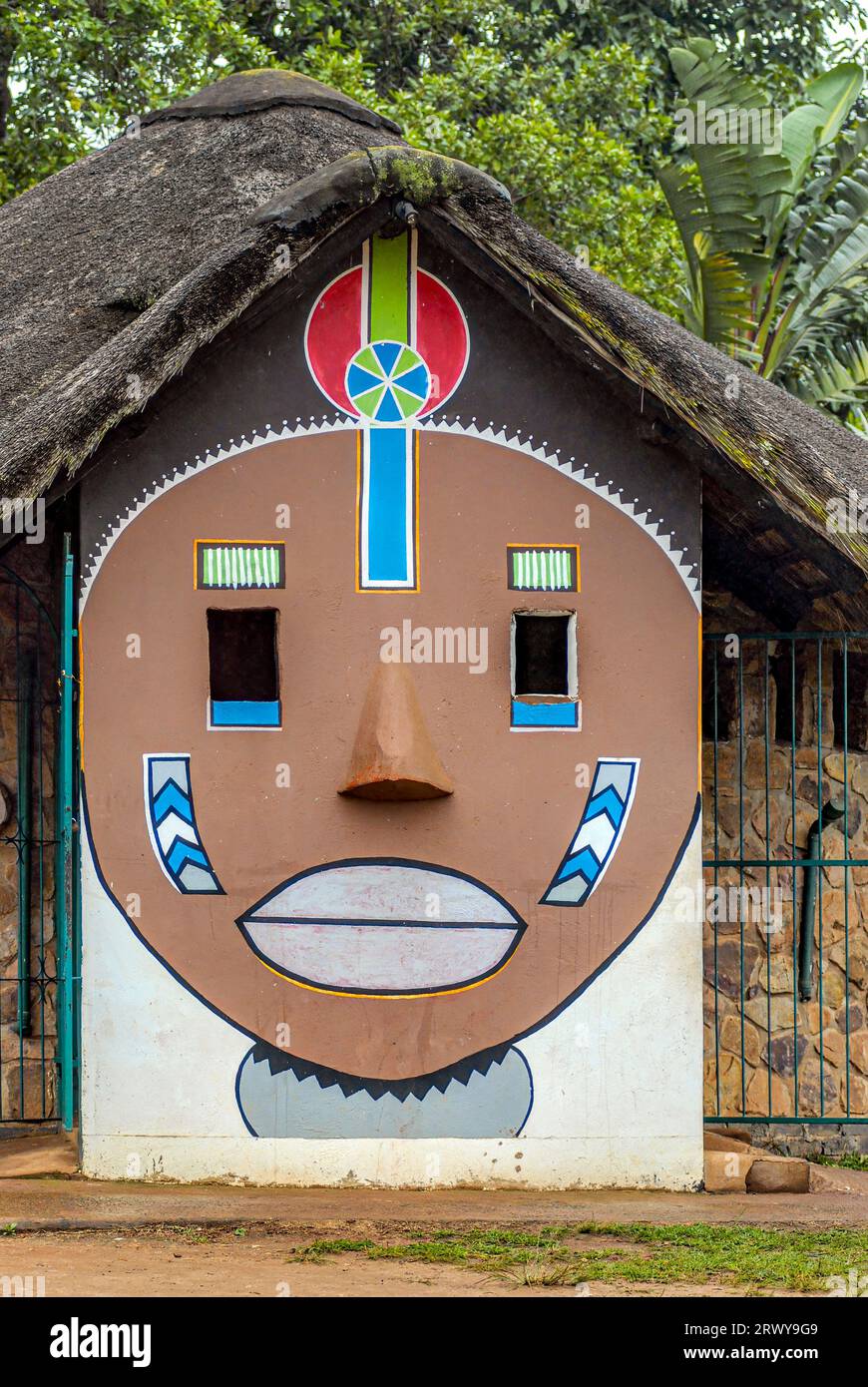 Colourful African wall painting with Zulu style ornaments on a hut in