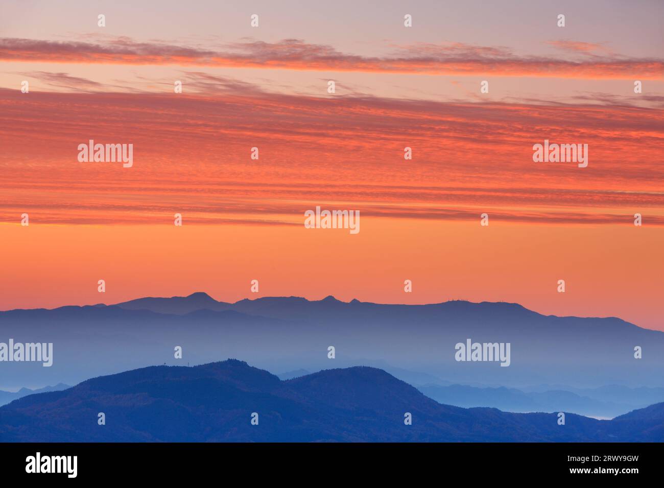 Morning glow and mountain ranges including Utsukushigahara and the Yatsugatake mountain range Stock Photo