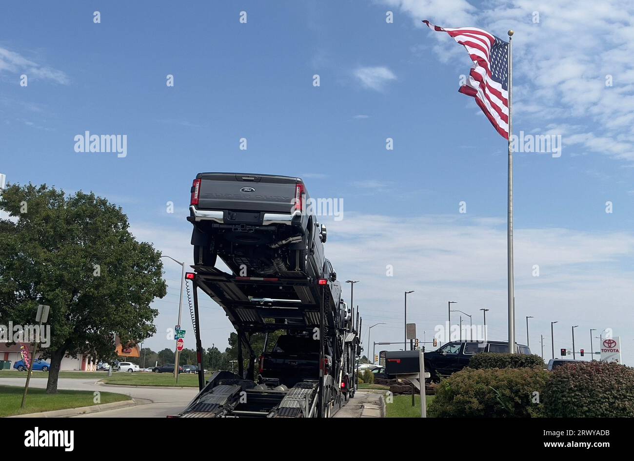 Emporia, KS, USA. 21st Sep, 2023. View of an auto transport delivering cars to various