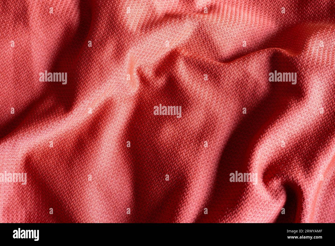 closeup of red polyester sport fabric, texture background Stock Photo