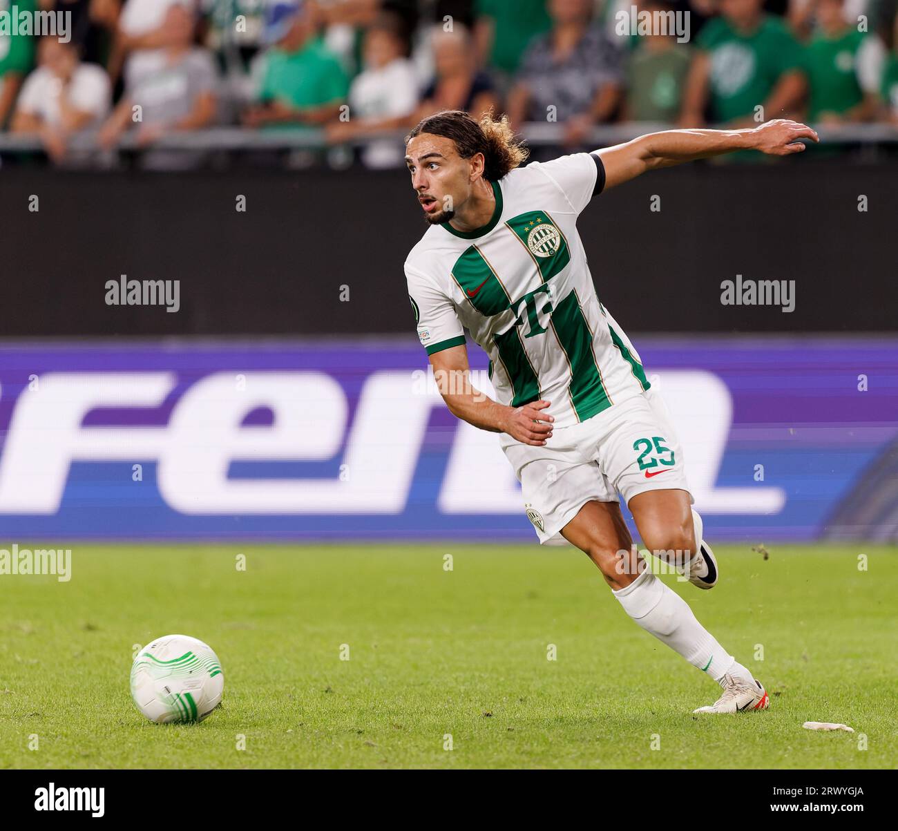 Budapest, Hungary. 31st August, 2023. Barnabas Varga of Ferencvarosi TC  competes for the ball with Nassim Hnid of FK Zalgiris Vilnius during the  UEFA Europa Conference League Play Off Round Second Leg