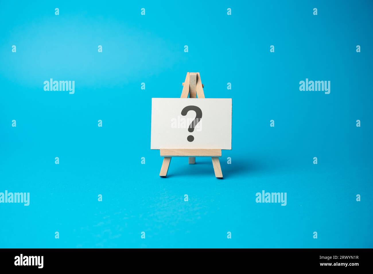 Question mark on the stand. Asking questions and seeking answers. Explore the unknown and seek