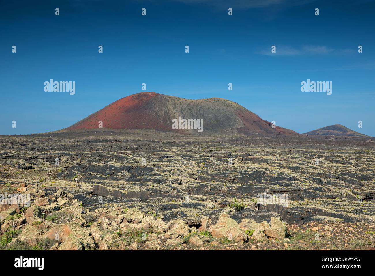 lava plain with Caldera Colorada, Canary Islands, Lanzarote, Masdache Stock Photo
