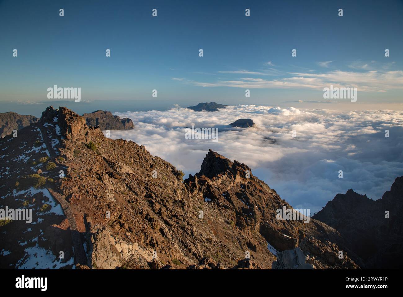 Roque de los Muchachos in evening light, cloud cover under the peak, Canary Islands, La Palma Stock Photo