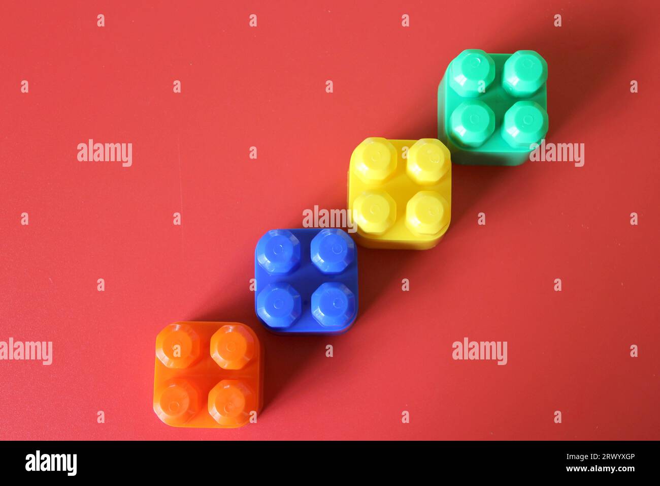 Pieces of plastic rainbow multicolored buildable toy blocks formed and