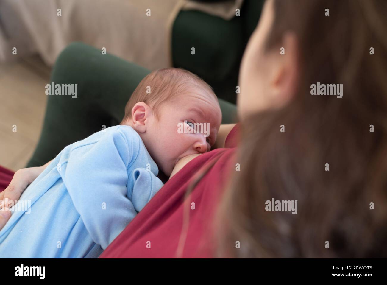 Mother breastfeeding newborn baby boy Stock Photo Alamy