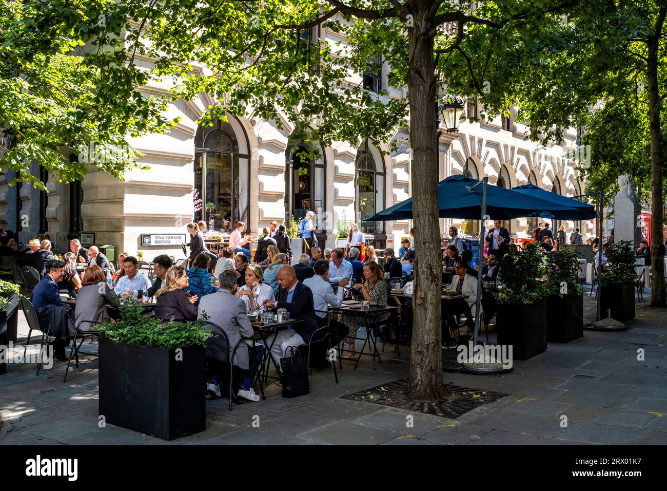 People Eating Outdoors At The Royal Exchange Buildings, City of London, London, UK. Stock Photo