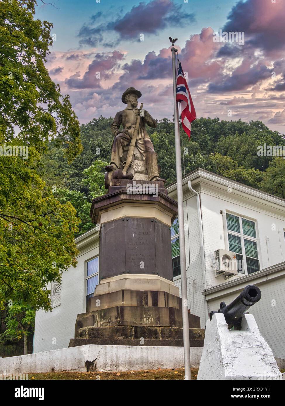 Statue of a civil war Union soldier with rifle in hand seated on a