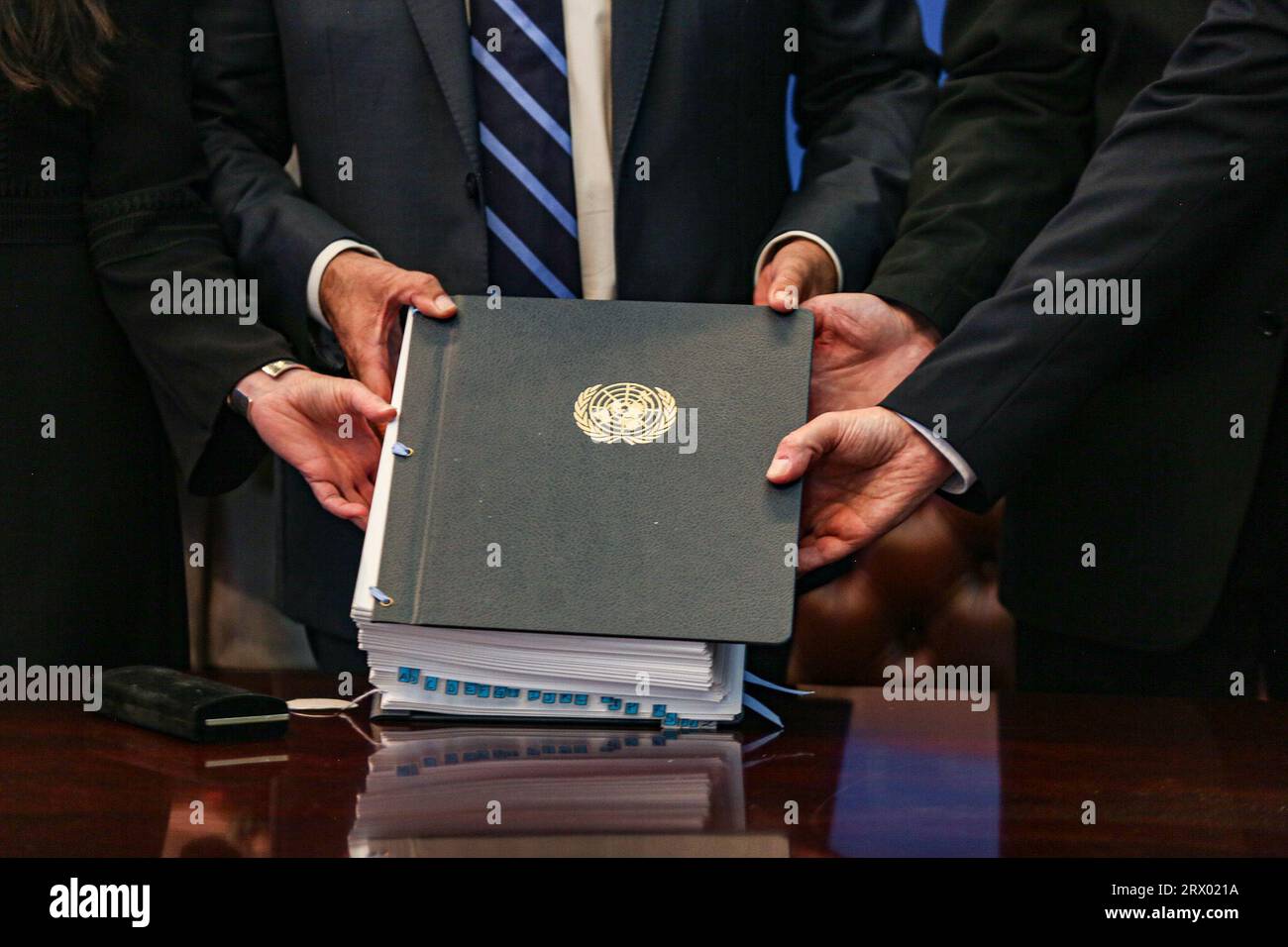 New York, New York, USA. 20th Sep, 2023. Hands together hold the book