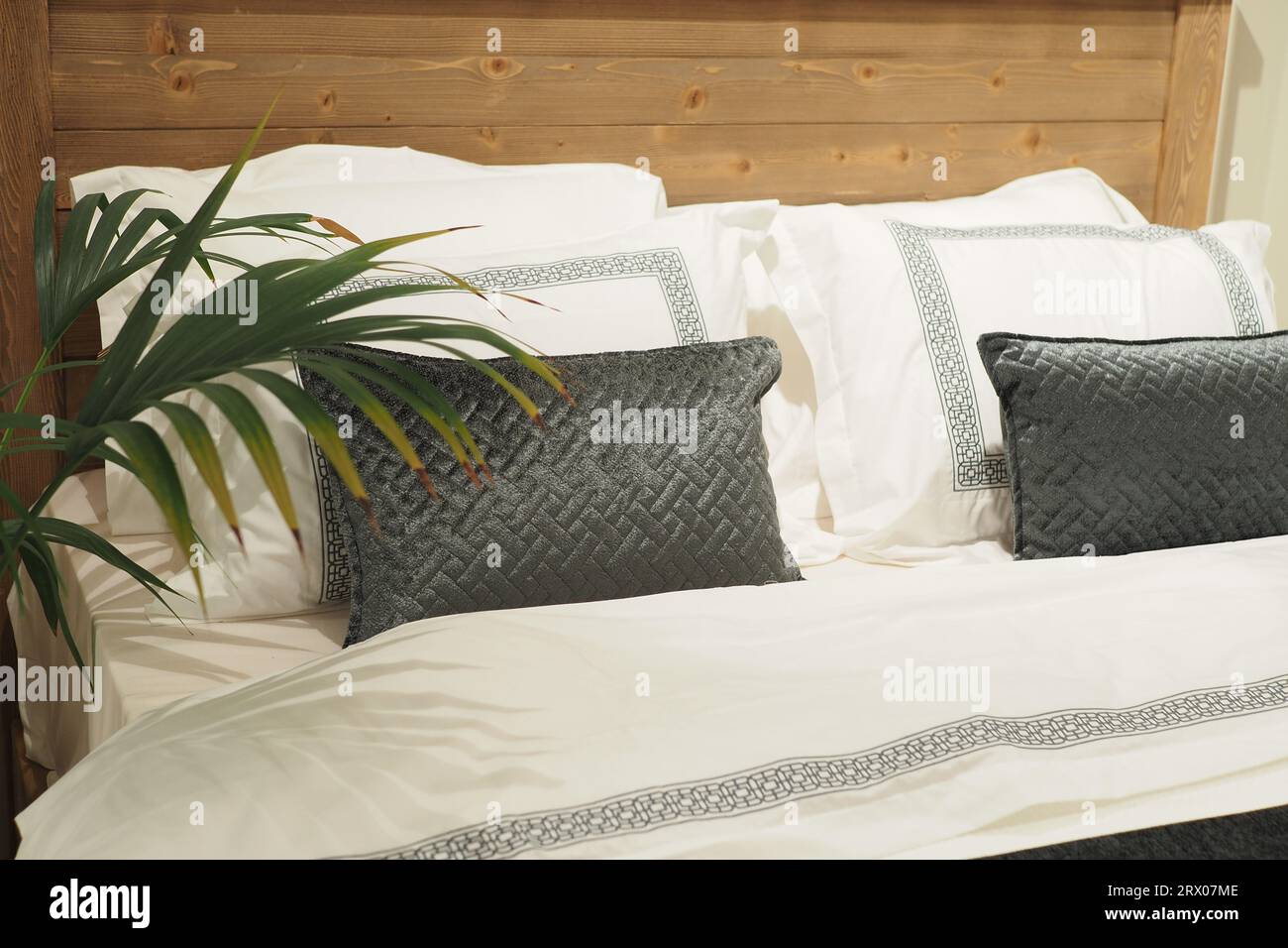 white pillow lined up on bed  Stock Photo
