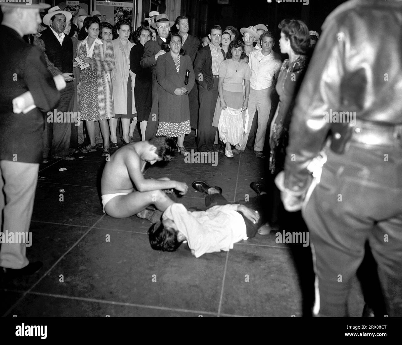 Victims of the Zoot Suit Riots, where groups of servicemen scoured the streets in Los Angeles looking for and attacking individuals wearing zoot suits (June, 1943). The servicemen blamed the Mexican American pachucos for numerous unprovoked assaults on their colleagues Stock Photo
