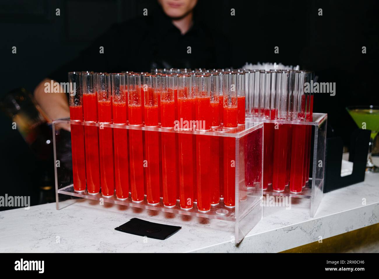 Red alcoholic cocktail Bloody Mary in test tubes. Tomato juice in