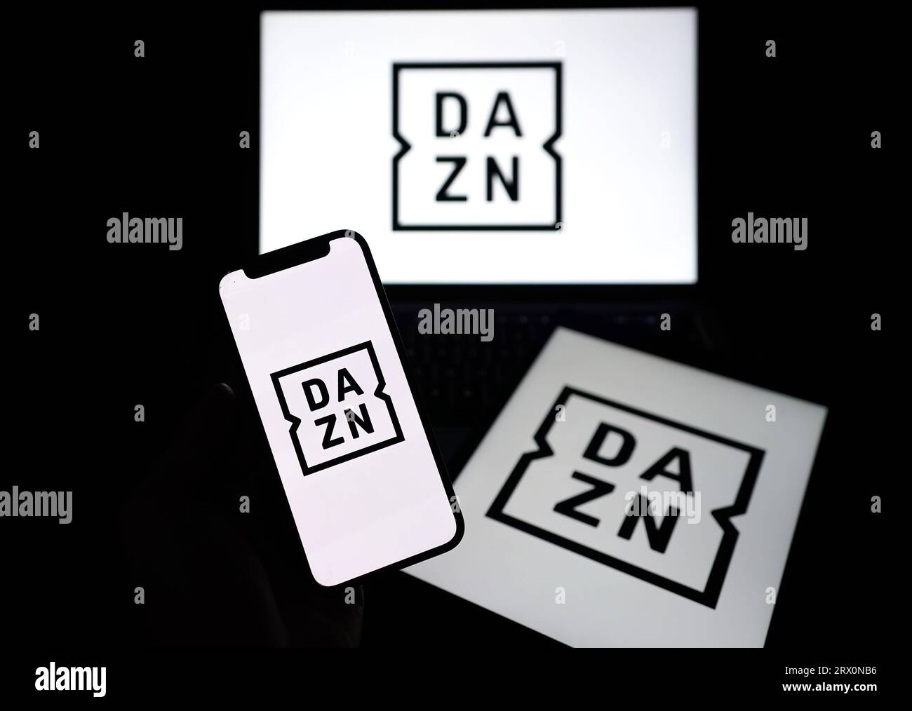 File photo dated 30/03/23 of the DAZN logo on device screens. A loophole in new legislation which could allow unregulated streaming services such as Amazon Prime, Apple TV and DAZN to buy live rights to 'crown jewel' sports events must be closed by the Government, a new report the Culture Media and Sport committee has said. Stock Photo