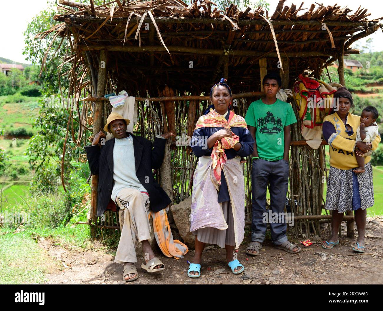 Malagasy people waiting for transport by their village in central Madagascar. Stock Photo