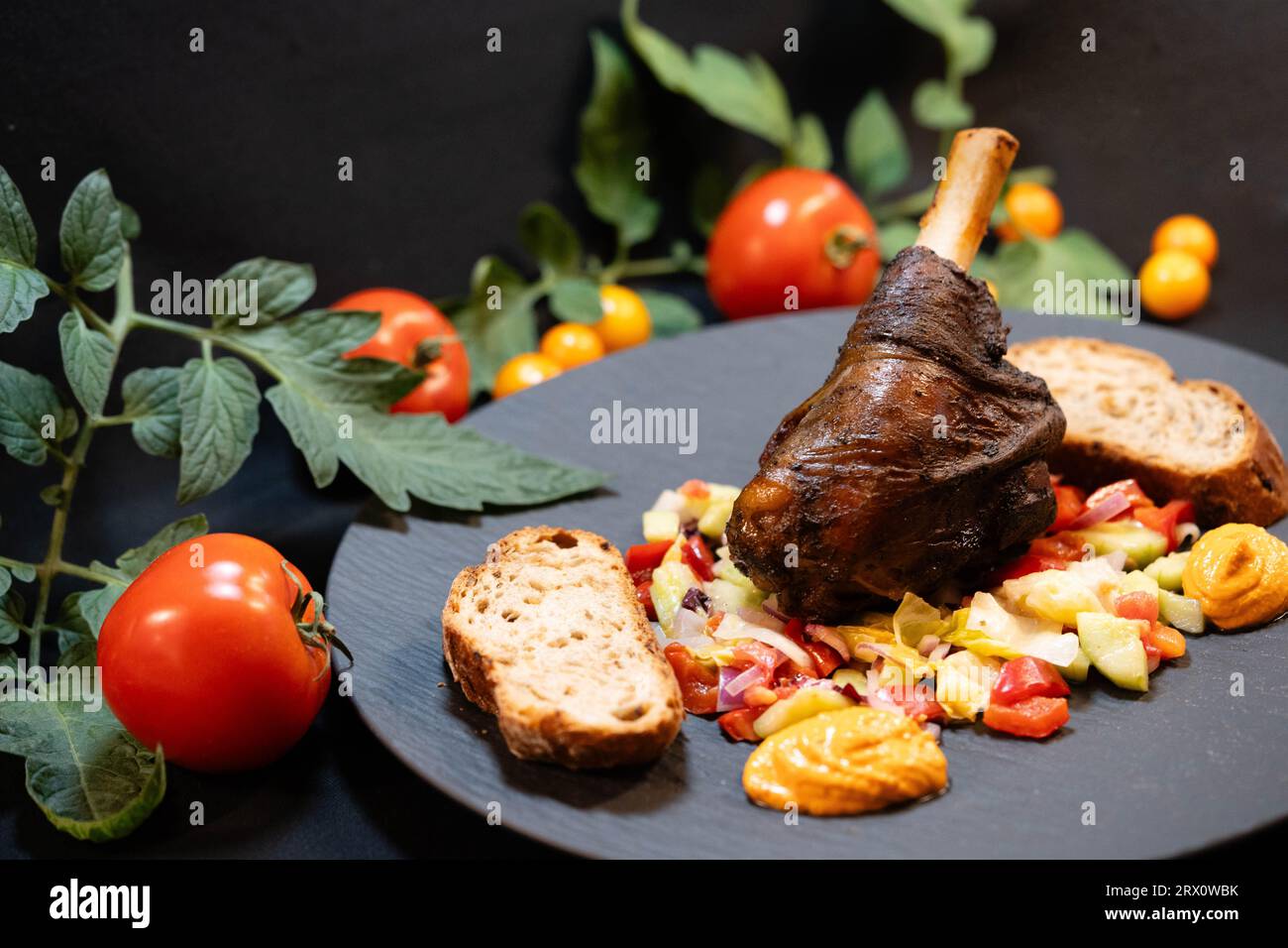 Grilled lamb shank from the charcoal grill with a fresh salad Stock