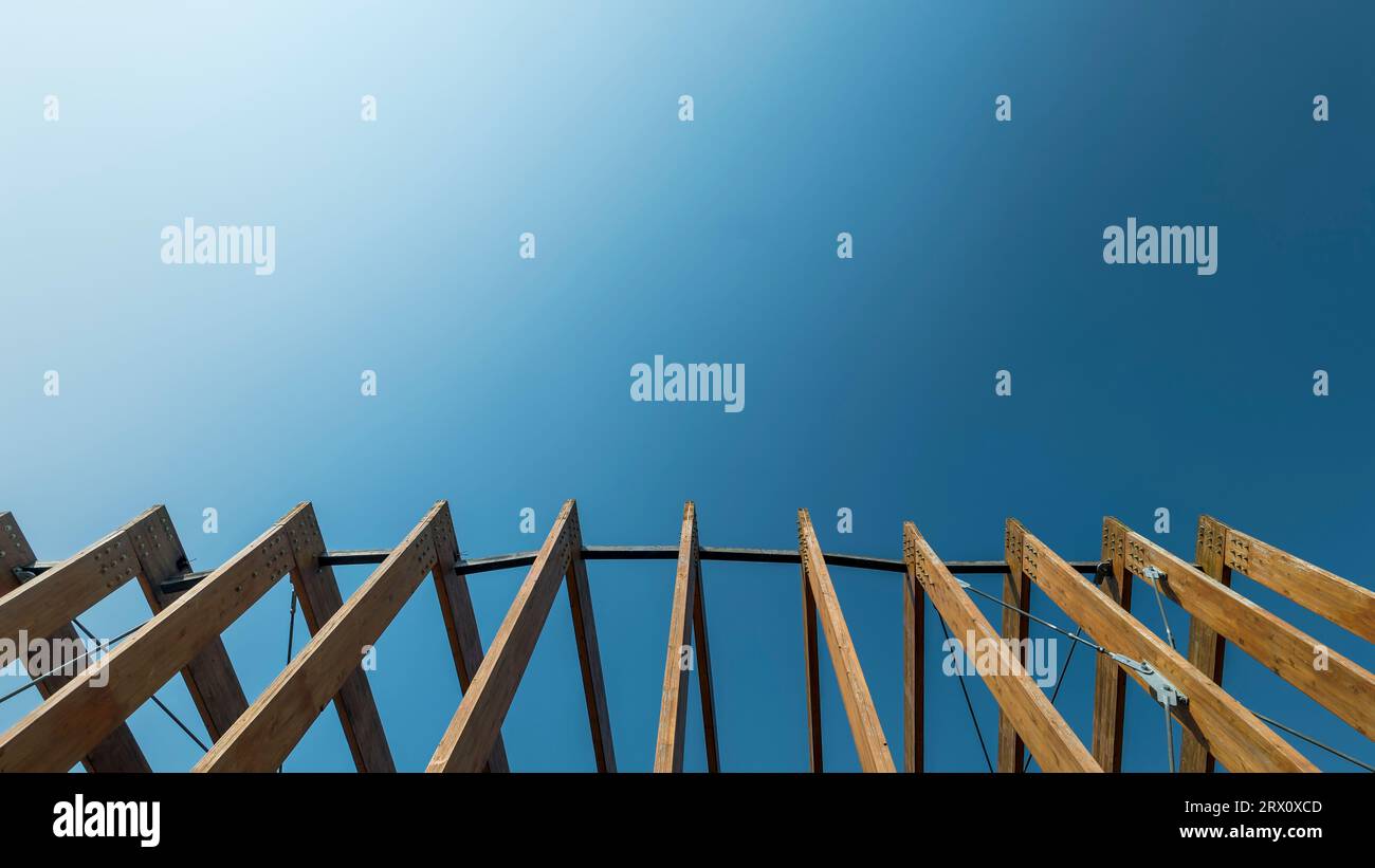 Wooden frames against a clear blue sky background Stock Photo