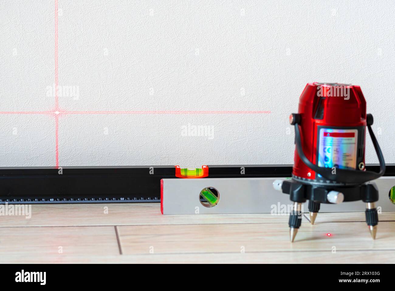 Laser level and Bubble levels, lines on the wall. measuring with red