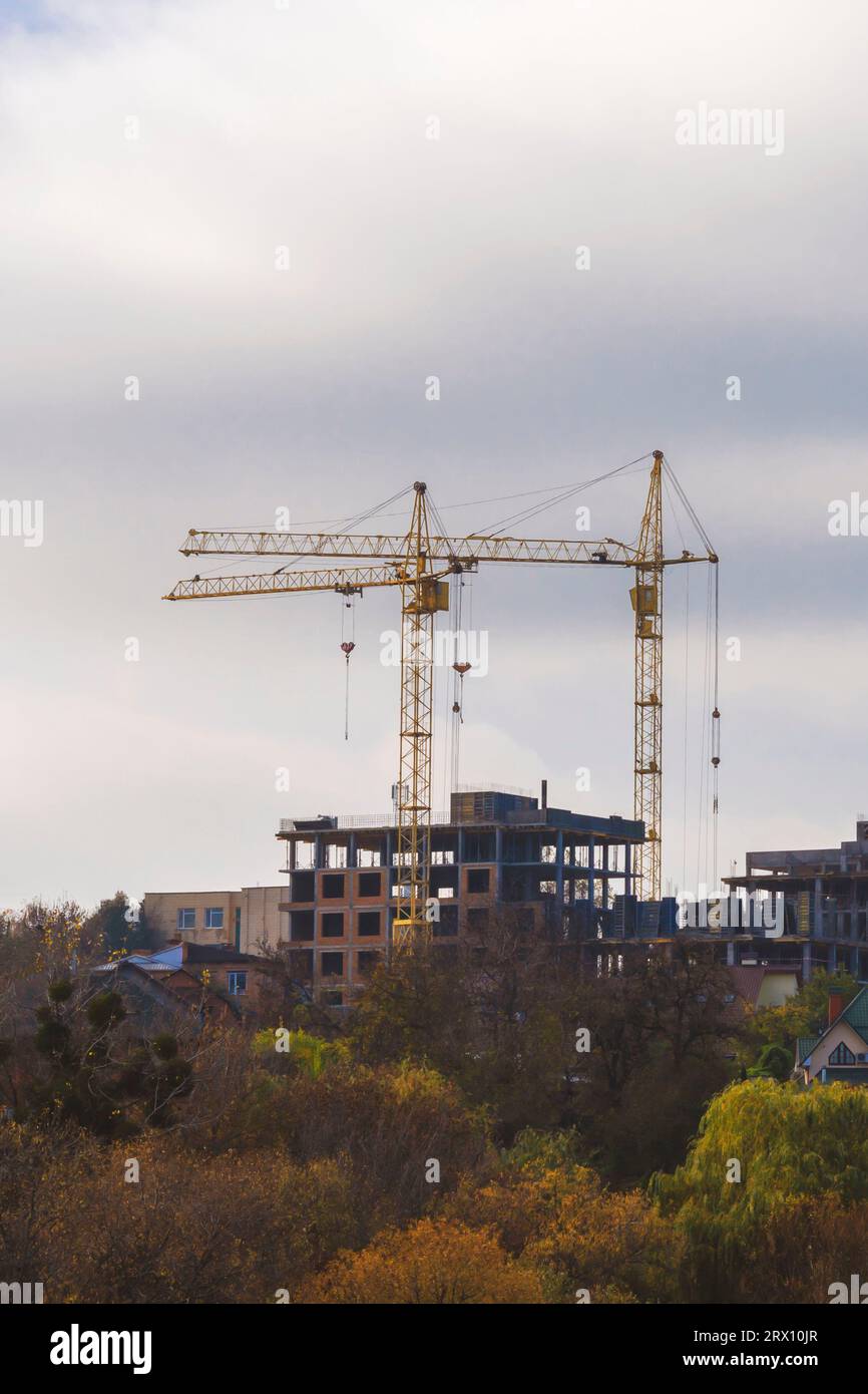 Building cranes against blue sky. tower cranes , Concept new building, realestate, housing