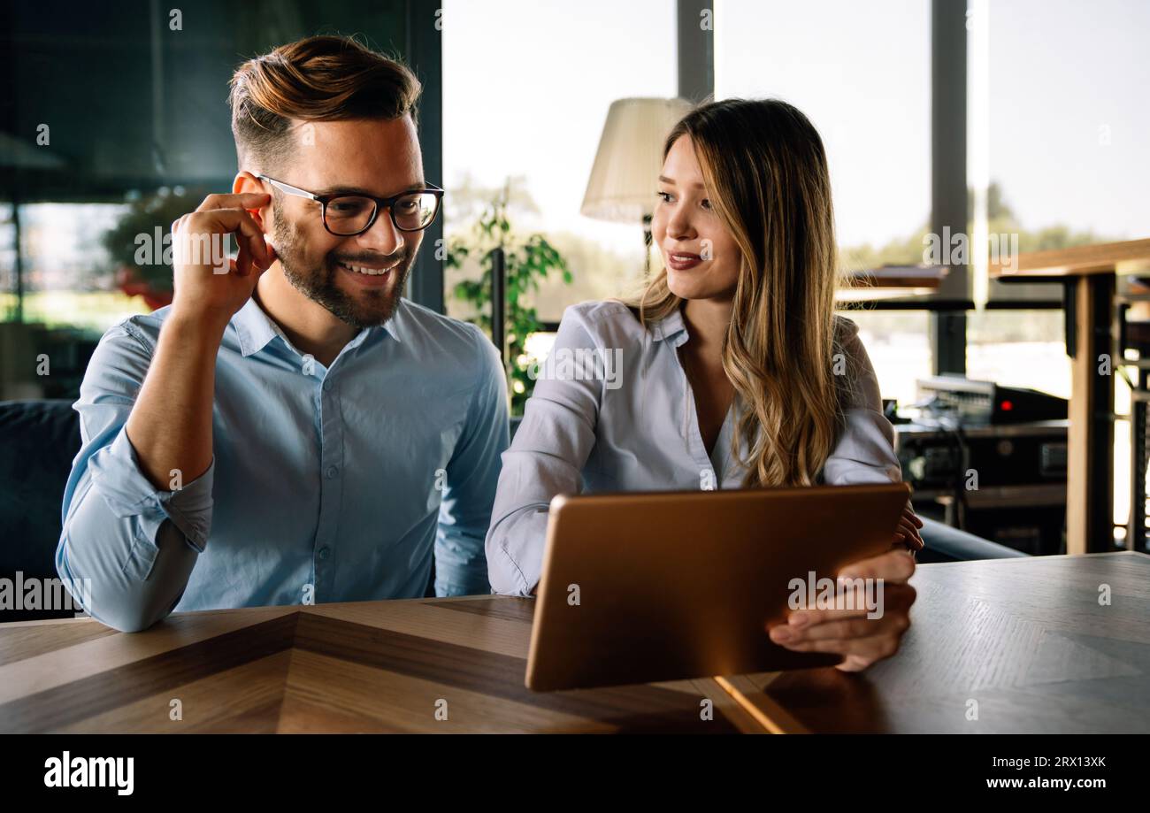 Business people working, having fun and chatting at workplace office Stock Photo