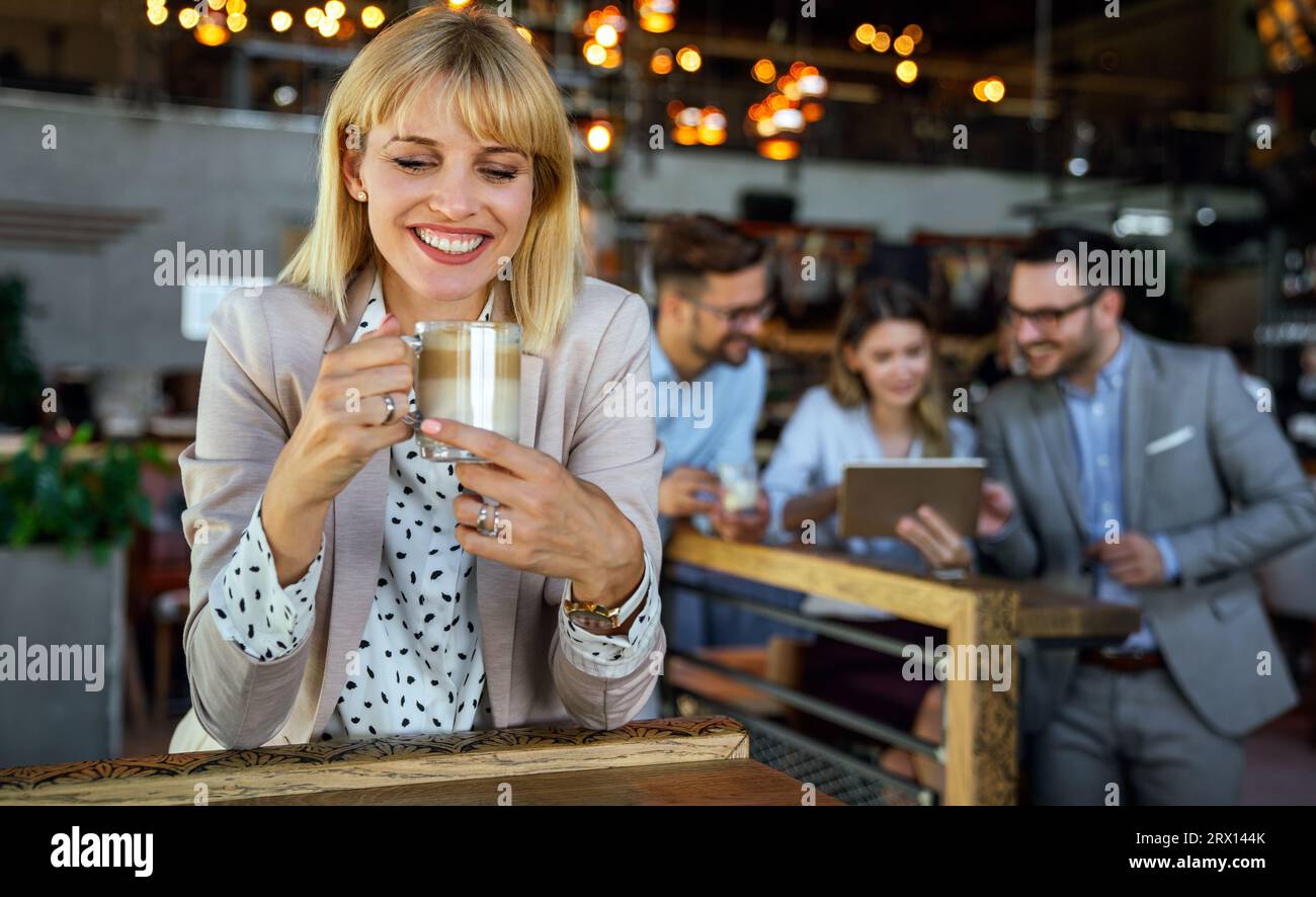 Business colleagues having conversation during coffee break Stock Photo