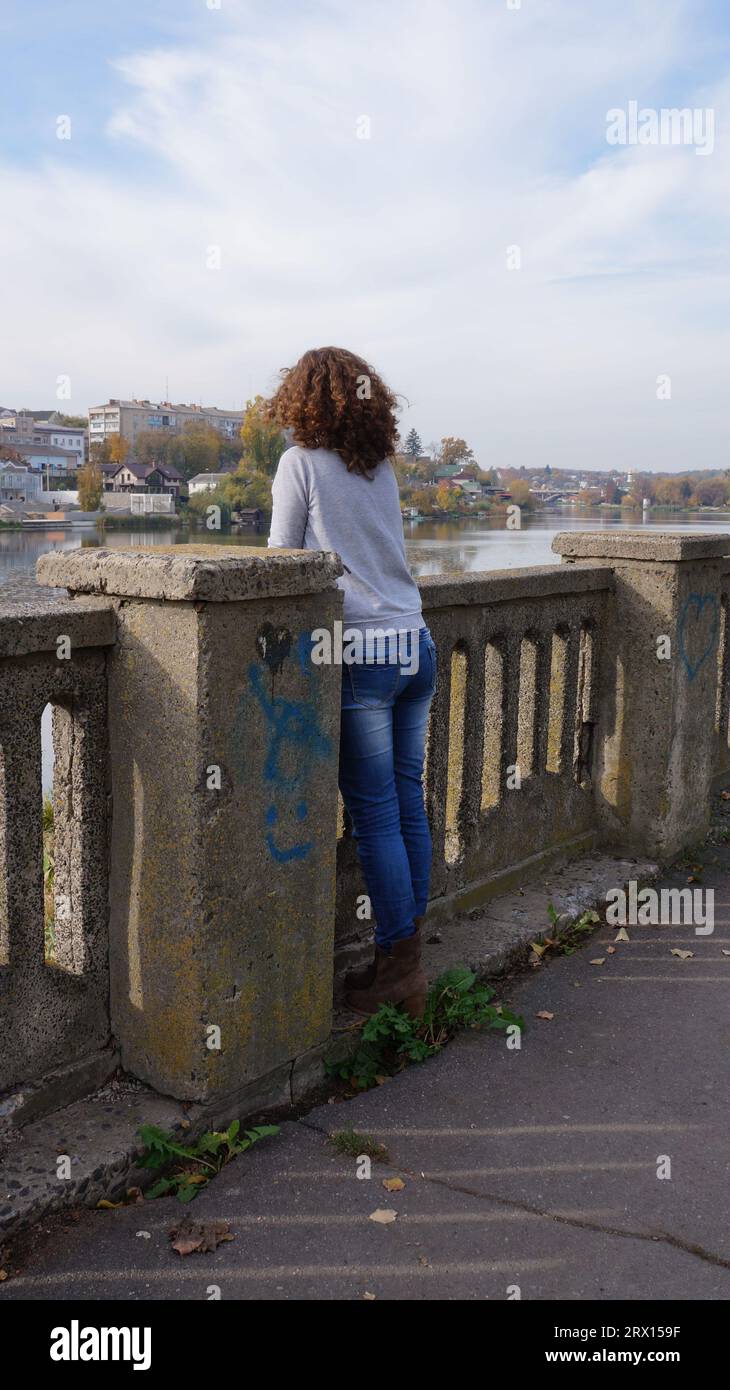 portrait of a girl in the fall, Girl on the embankment of the river ...