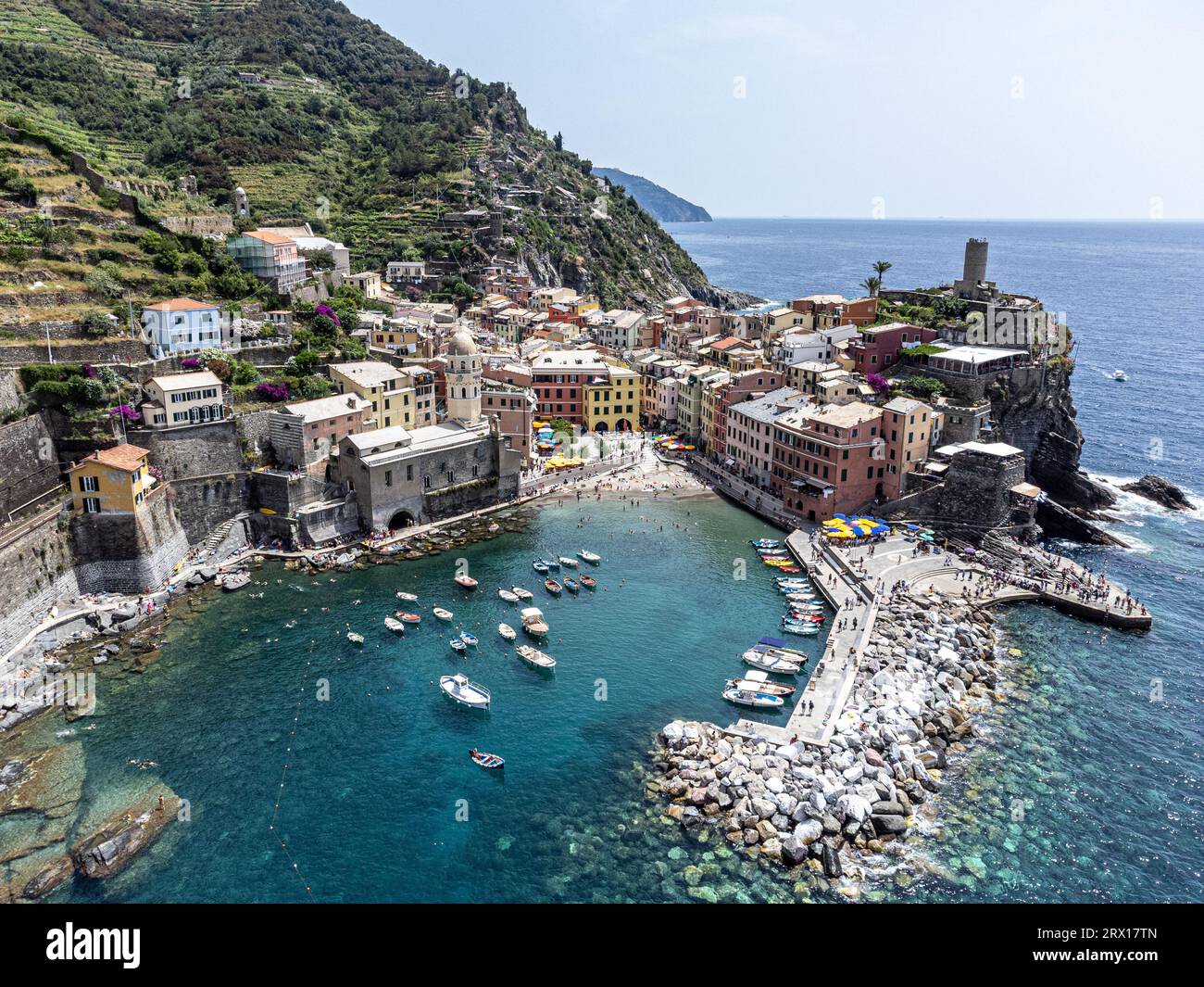 An aerial view of a small town situated on a body of water with ...