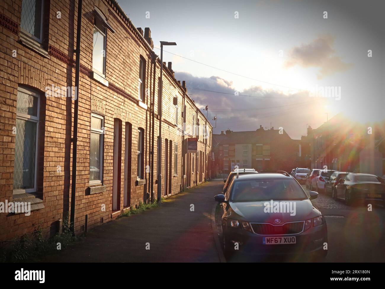 Low evening sun over a northern terraced street, Latchford village