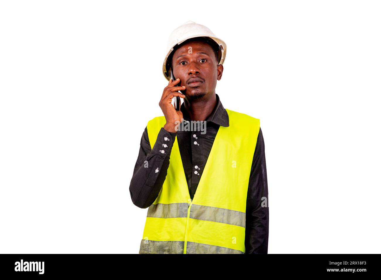 entrepreneur man standing on white background talking on cellphone. Stock Photo