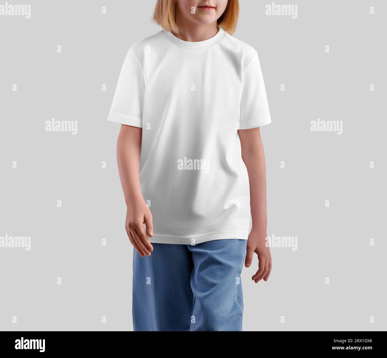 Mockup of a white t-shirt on a walking girl, isolated on the background, front view. Template of a stylish kid's shirt for design, print, pattern. Fas Stock Photo