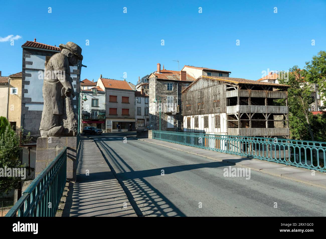 Maringues. The monumental sculpture of the tanner on the bridge. Puy de Dome dapartment. Auvergne-Rhone-Alpes. France Stock Photo
