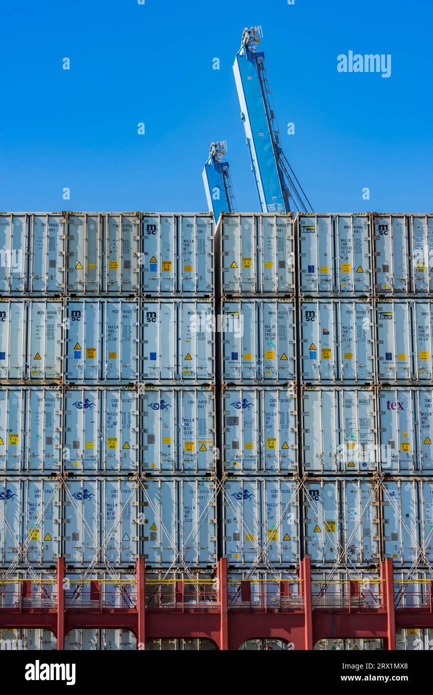 Transport freighter with shipping containers, blue sky Stock Photo