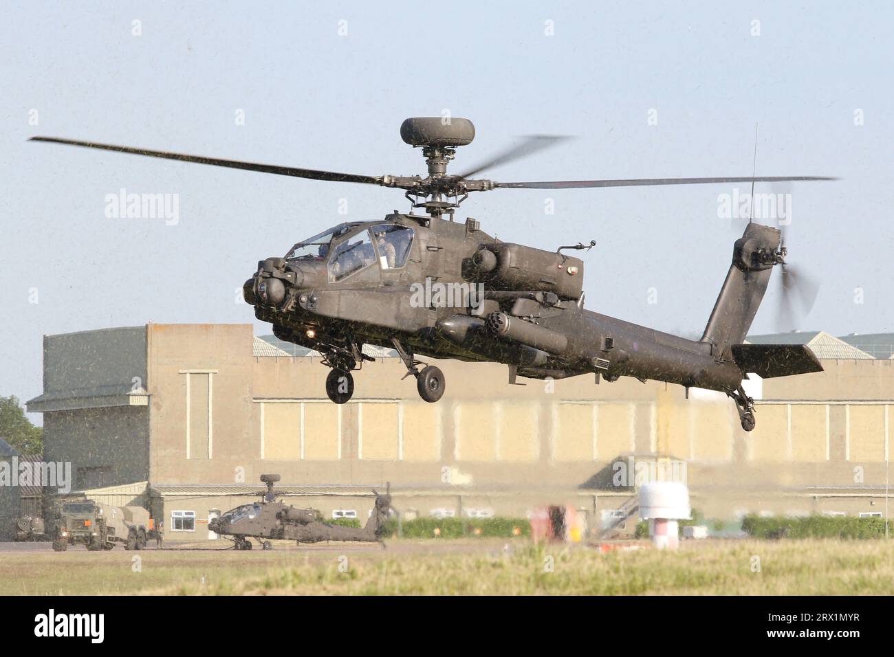 Army Air Corps WAH-64D Apache conducting hover training over the freshly cut grass at Wattisham Airfield. Stock Photo