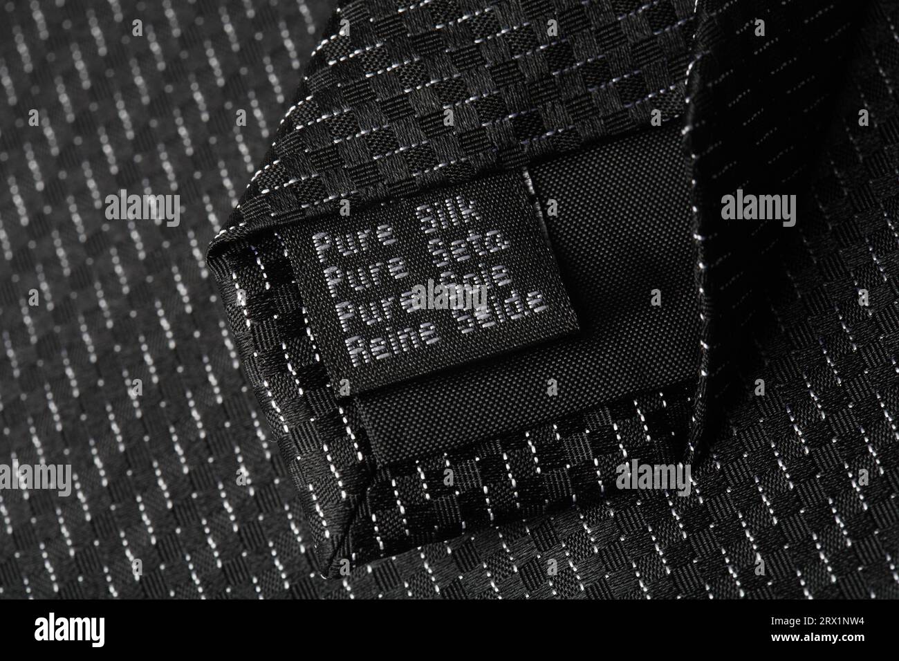 Pure silk label on a tie Stock Photo