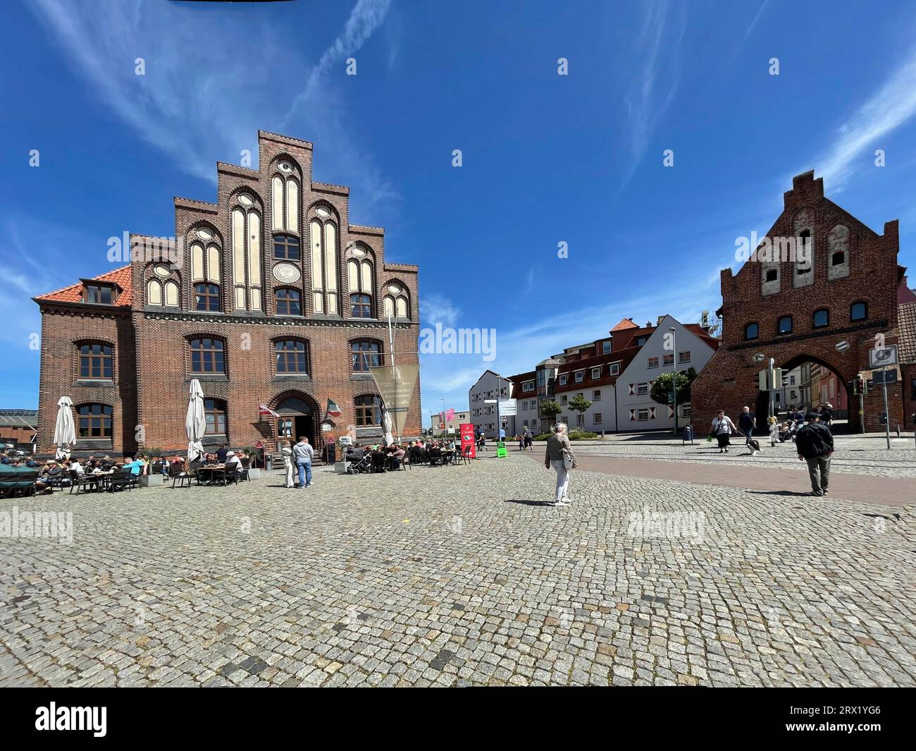 Restaurant in former warehouse, Old Water Gate, Gothic harbour gate from 1450, old town, harbour, Hanseatic city, Wismar, Mecklenburg-Western Stock Photo
