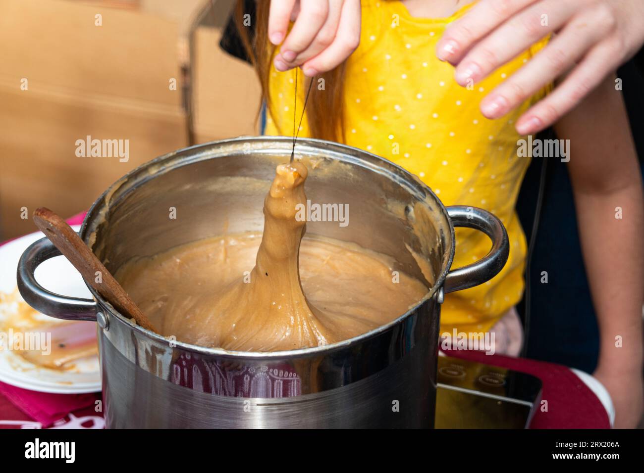 process of preparing of the traditional Armenian sweet Sujuk (Churchkhel). It's a peeled walnut