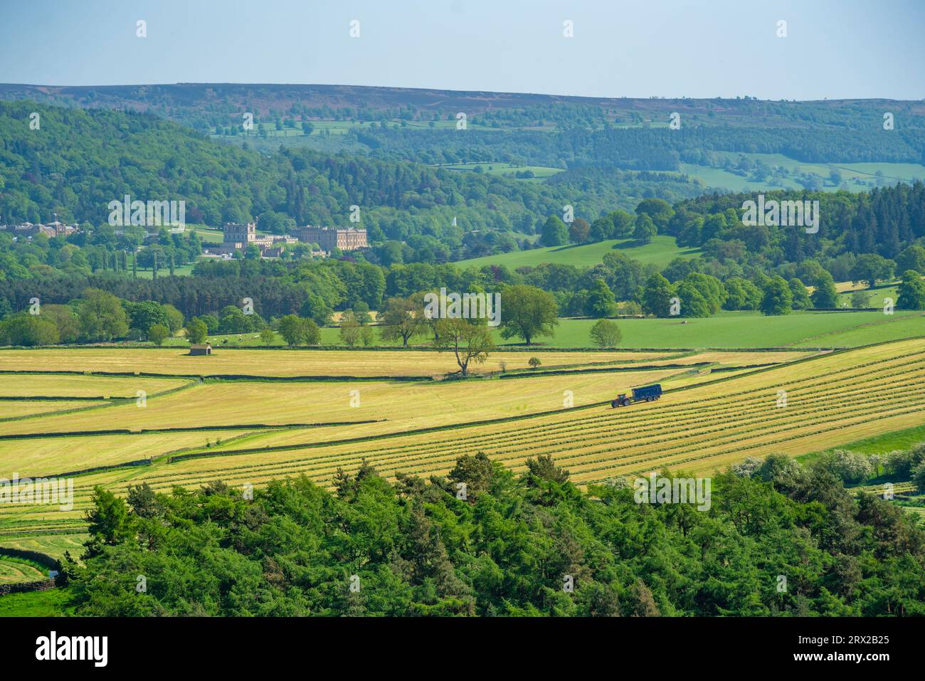 View of farmland and Chatsworth House in spring, Derbyshire Dales