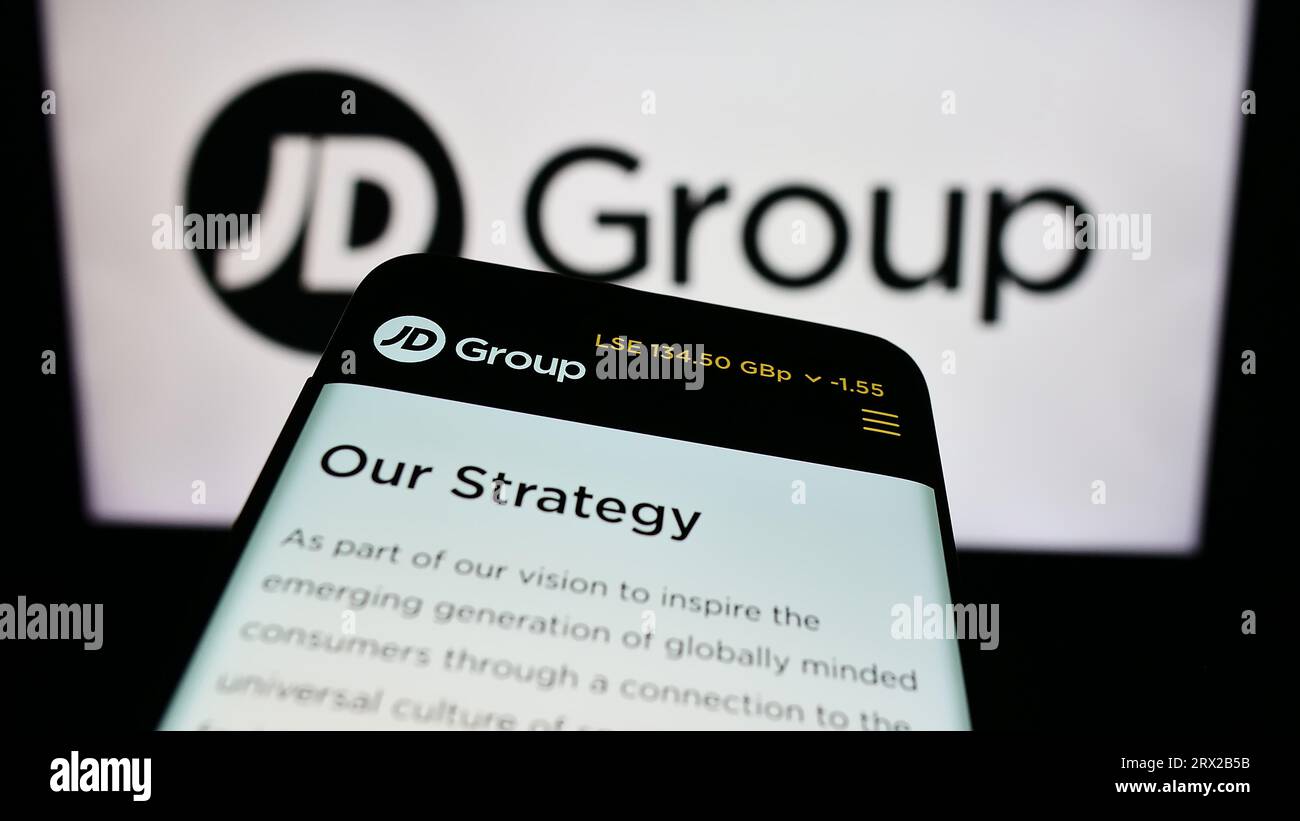 Mobile phone with website of British retail company JD Sports Fashion