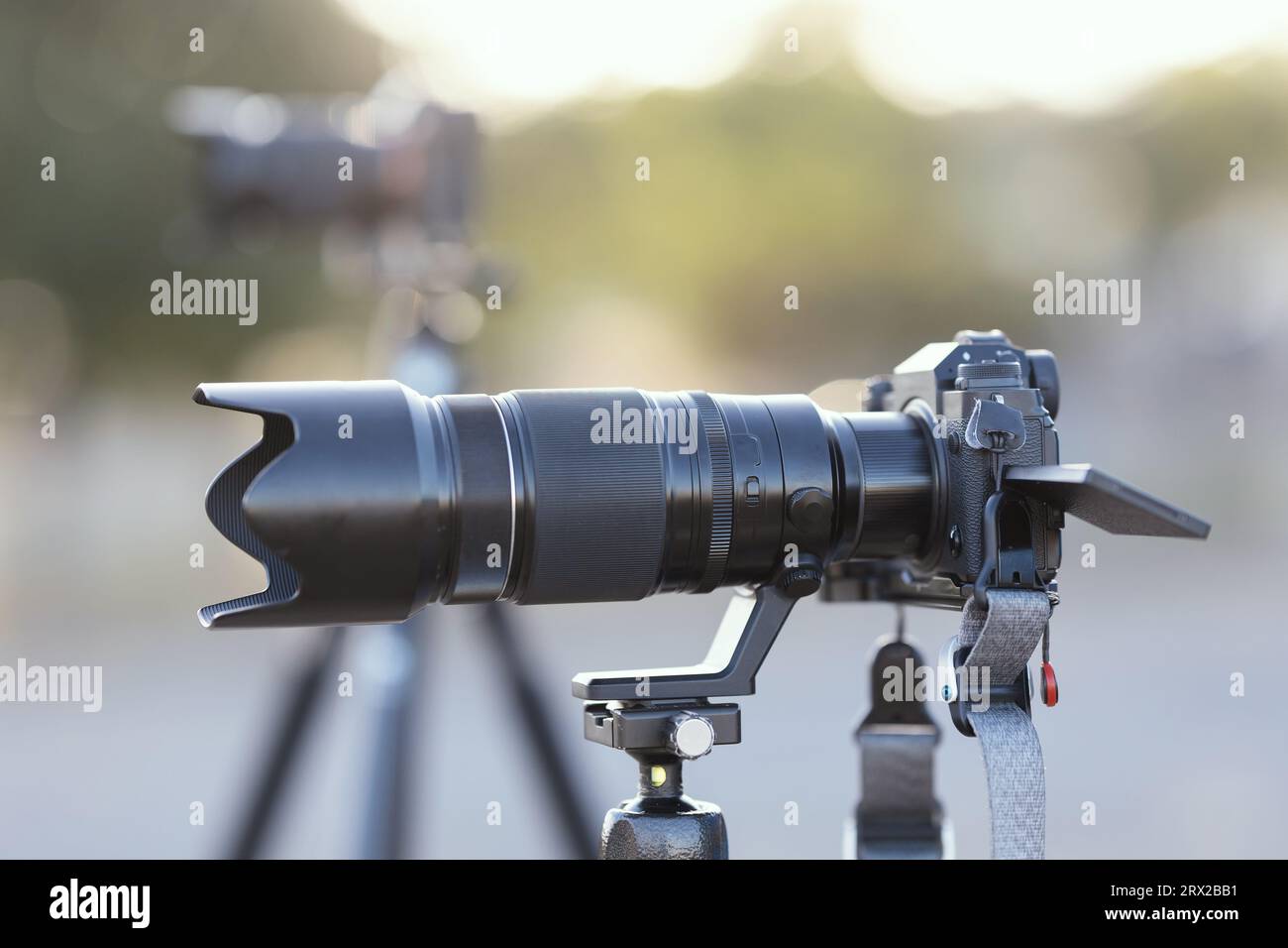 Cameras with large lenses in the field. Mid shot Stock Photo Alamy