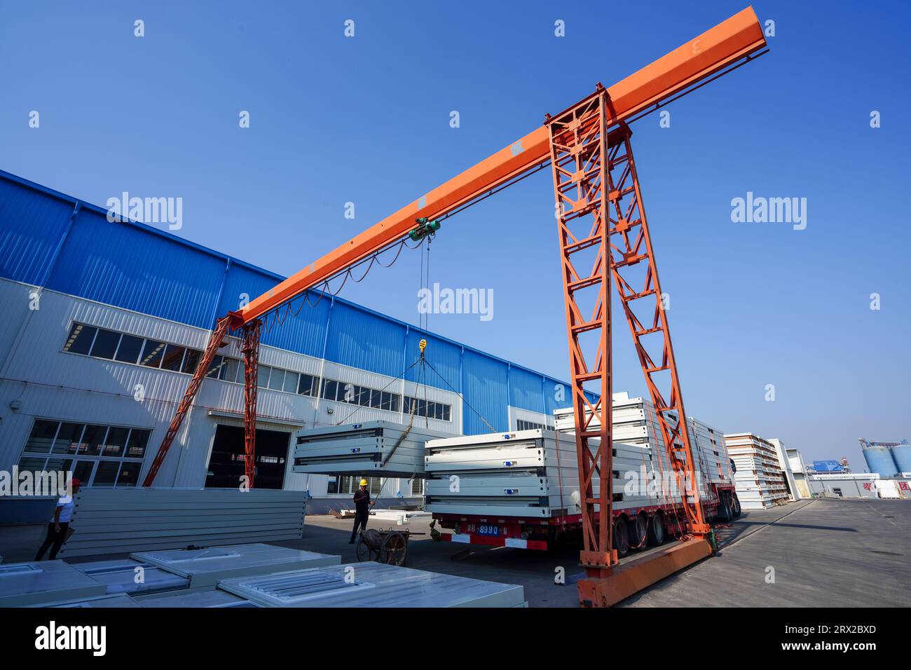 Luannan County, China - September 21, 2022: Workers load and transport in the lifting box room, North China Stock Photo