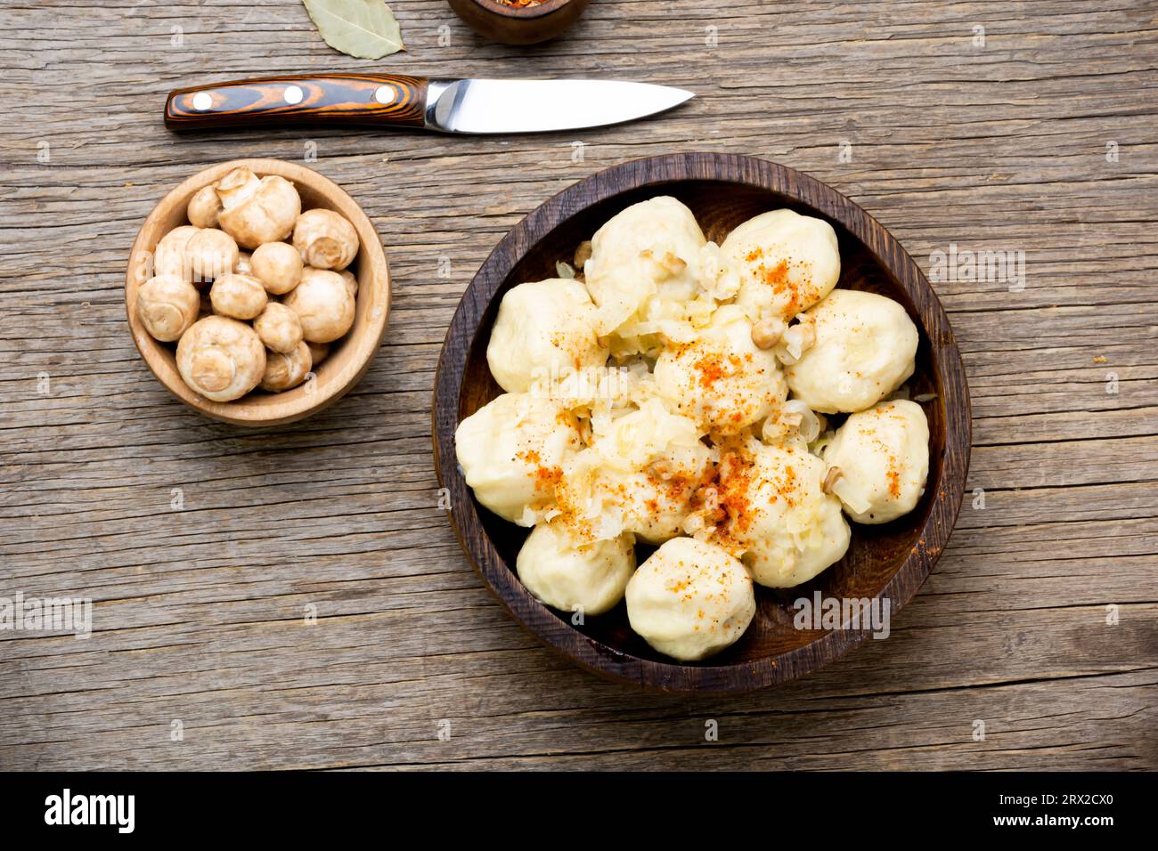 Uncooked knedliki, made from dough, potatoes with mushroom filling. Traditional Czech cuisine Stock Photo