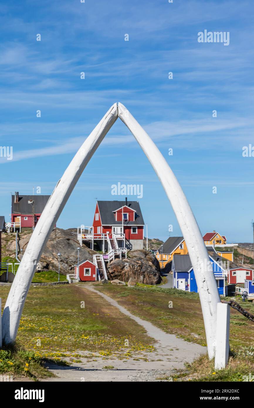 The town of Sisimiut as seen through whale jawbone arch, Western Greenland, Polar Regions Stock Photo