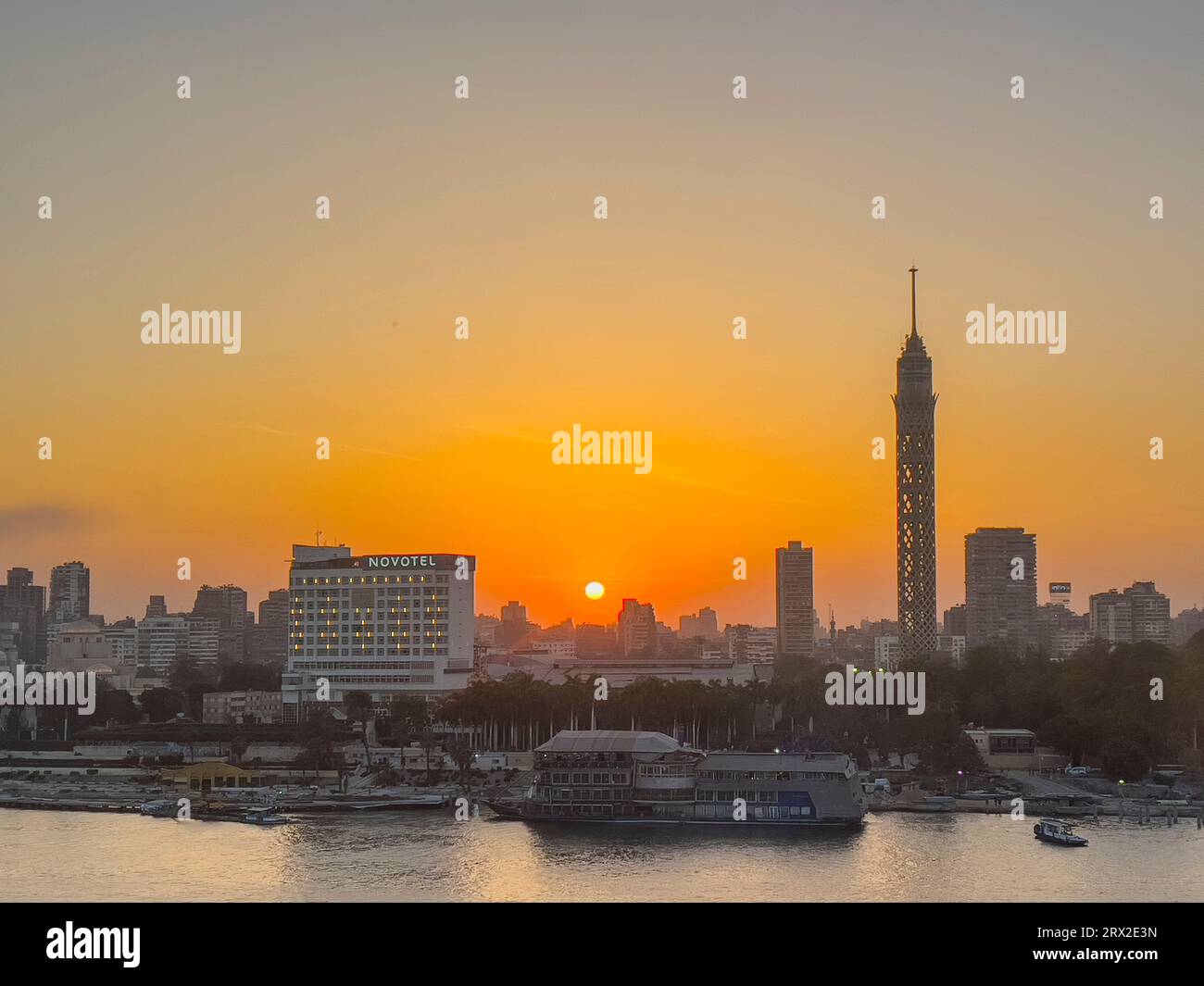 Sunset over the Cairo Tower from the east side of the Nile River, Cairo, Egypt, North Africa, Africa Stock Photo