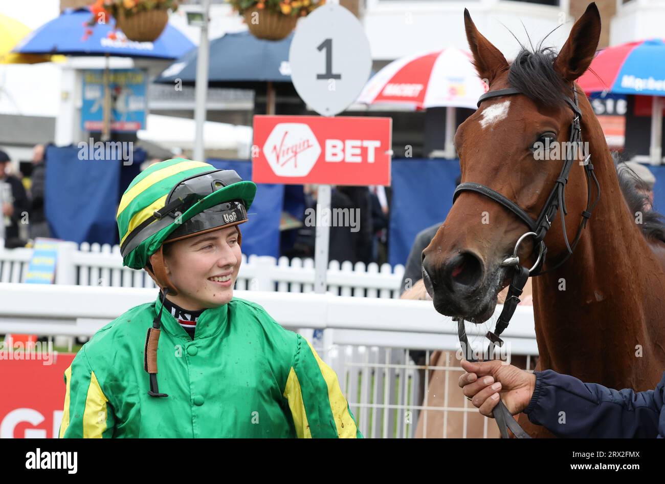 Miss Roberts and Jockey Saffie Osborne after winning the Virgin Bet